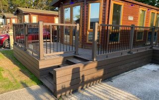 Dark brown Neotimber decking installed surrounding a static home