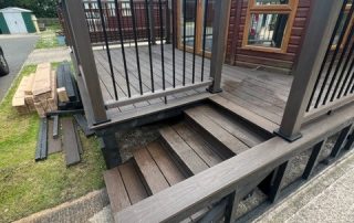 Brown composite decking installed surrounding a static home