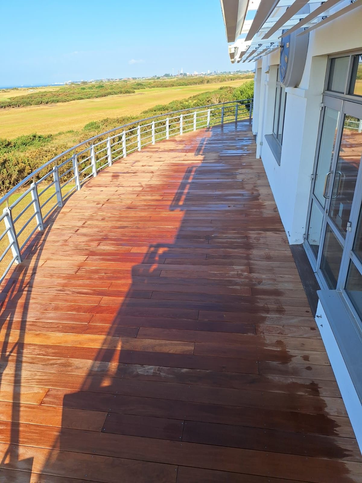 Hayling Island, Hampshire – Hayling Golf Club – Cumaru Wooden Decking 9 High view of composite decking installed on a balcony at a golf club on Hayling Island