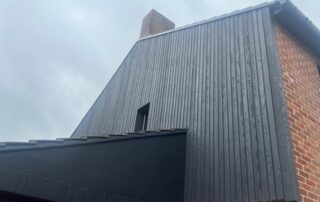 Millboard Composite Cladding in Burnt Cedar Waterlooville 1 Cladding installed to the side of a house in Waterlooville