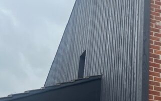 Millboard Composite Cladding in Burnt Cedar Waterlooville 2 Cladding installed to the side of a house in Waterlooville