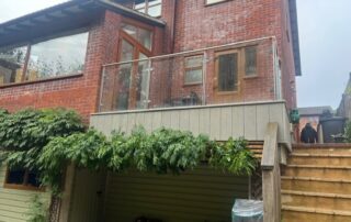 Millboard Composite Decking Terrace in Smoked Oak Waterlooville 1 Far view of composite decking balcony installed in Waterlooville