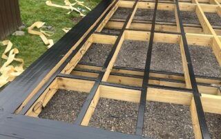 Millboard Composite Decking in Antique Oak Waterlooville 1 Wooden scaffolding work in progress to create a composite decking porch in Waterlooville