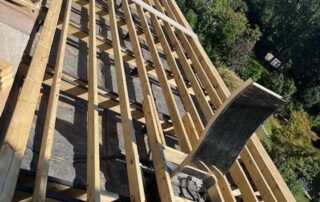 Millboard Composite Decking in Smoked Oak Farnham 13 Wooden scaffolding being installed to a house in Farnham