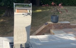 Millboard Composite Decking in Smoked Oak Farnham 5 Edge view of composite decking porch installed in Farnham